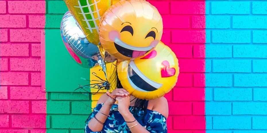 Smiling face emoji on balloons